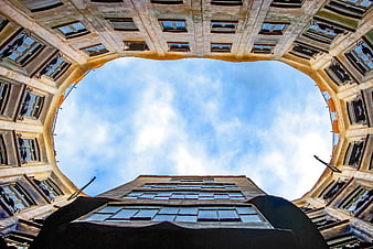360-degree fisheye view of urban architecture and sky