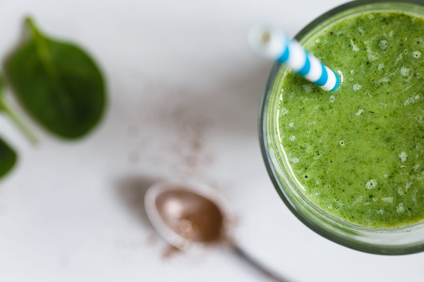 Top View Green Smoothie with Spinach and Cocoa Powder