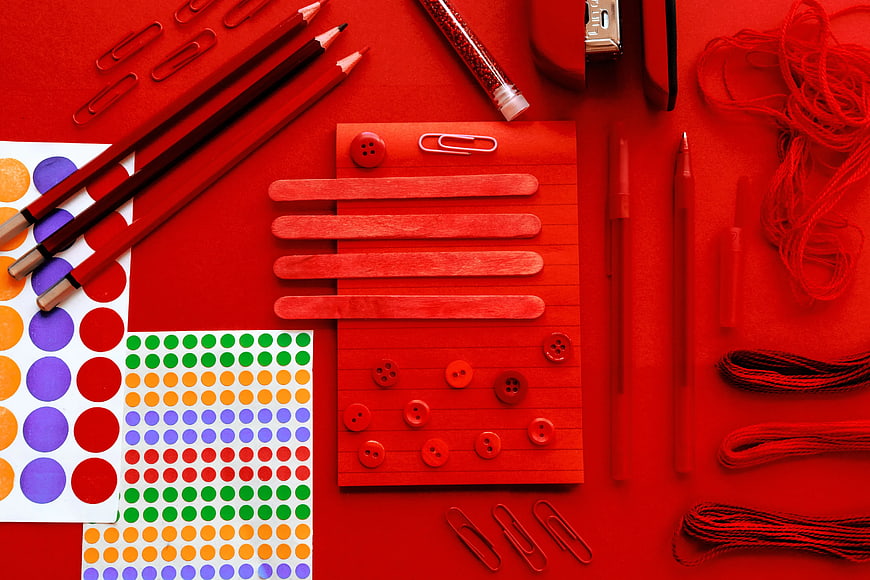 Red Flat Lay of Craft Supplies and Stationery