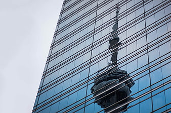 Reflection of CN Tower on Glass Skyscraper Facade