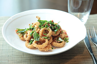 Fried Calamari Squid Rings with Basil Garnish
