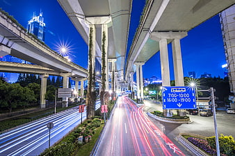 Long exposure night traffic under elevated highway overpass
