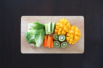 Chopped Fruits and Vegetables on Wooden Cutting Board