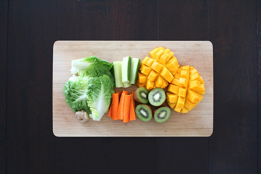 Chopped Fruits and Vegetables on Wooden Cutting Board