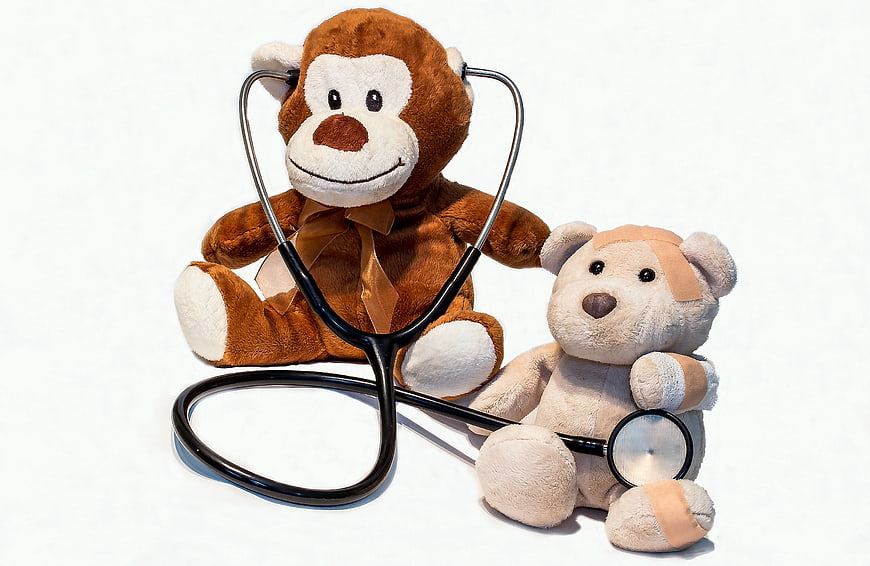 Stuffed Monkey Doctor and Injured Teddy Bear with Stethoscope