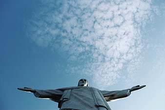 Low angle view of Christ the Redeemer statue against blue sky