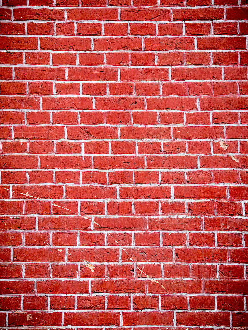 Textured Red Brick Wall Background with White Mortar
