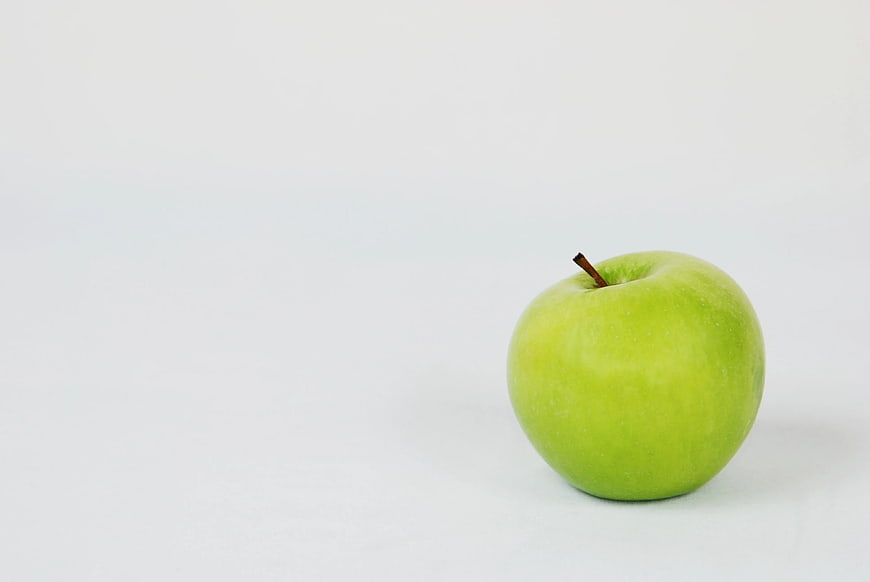 Single Green Apple on White Background