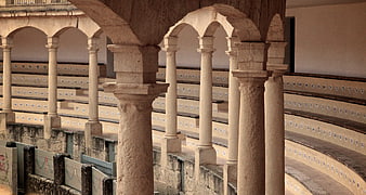 Stone arches and columns in historic Ronda bullring interior
