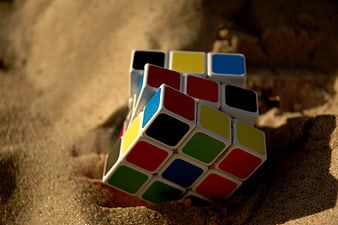 Rubik's Cube Buried in Sand on Beach