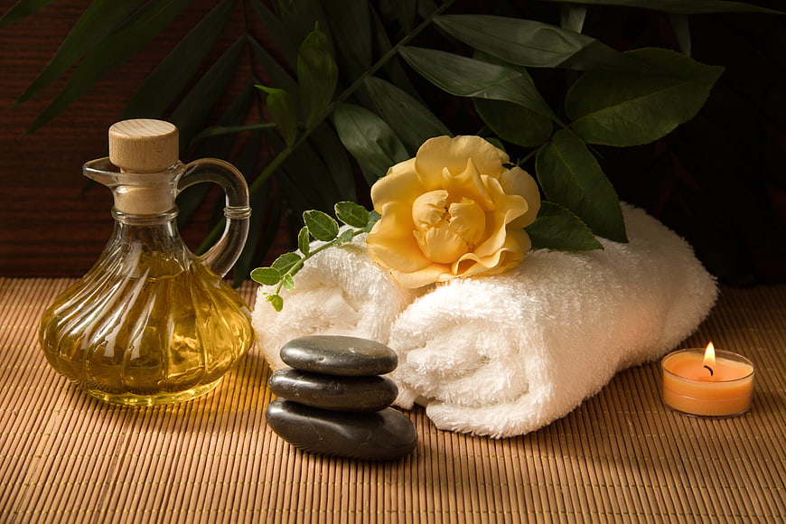 Spa Wellness Still Life With Oil, Stones, Towels, and Candle
