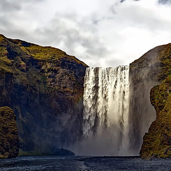 Majestic Skógafoss Waterfall in Iceland with Mossy Cliffs