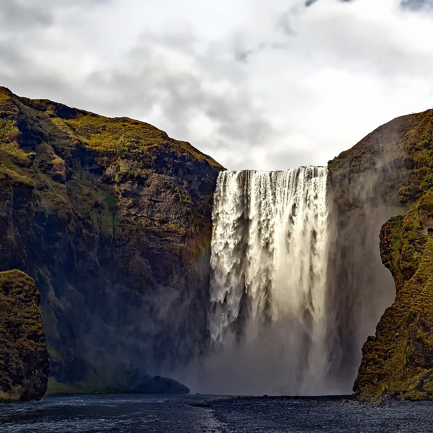Majestic Skógafoss Waterfall in Iceland with Mossy Cliffs