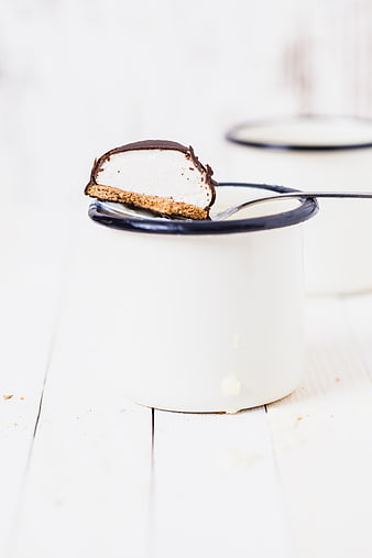 Chocolate Covered Ice Cream Bar on Spoon in White Cup