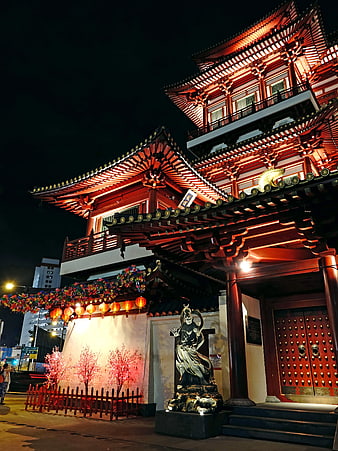 Illuminated Traditional Asian Temple at Night