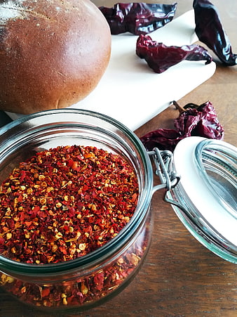 Jar of Crushed Red Pepper Flakes with Bread