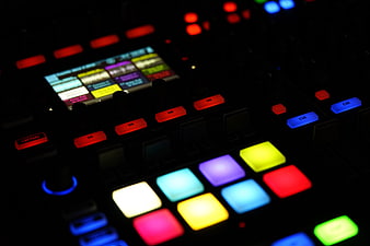 Illuminated DJ Controller Pads and Buttons in Dark Studio