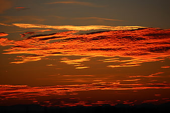 Dramatic Fiery Orange Sunset Sky With Glowing Clouds