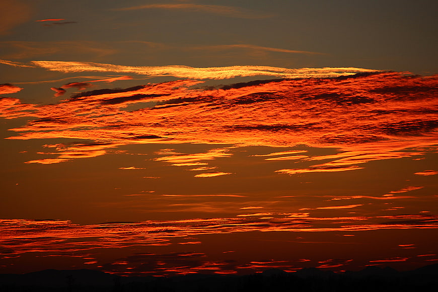 Dramatic Fiery Orange Sunset Sky With Glowing Clouds