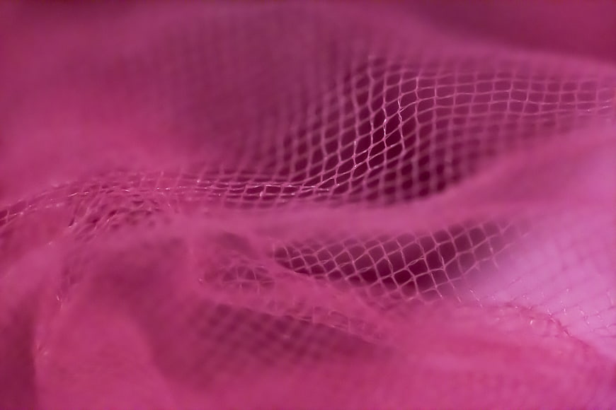 Close-up of pink mesh fabric texture