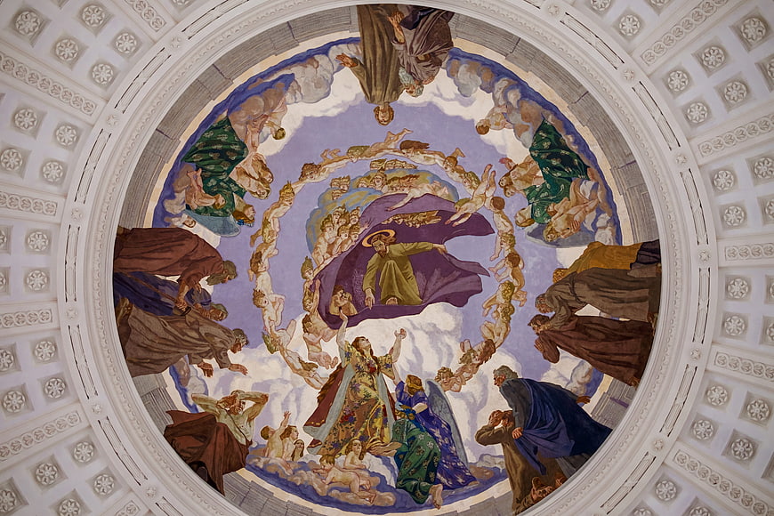Religious dome ceiling fresco depicting saints and angels