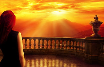 Woman on Balcony Watching Dramatic Orange Sunset Over Mountains