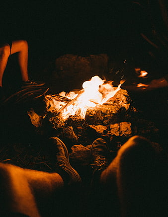 Campfire at Night with Friends Warming Feet