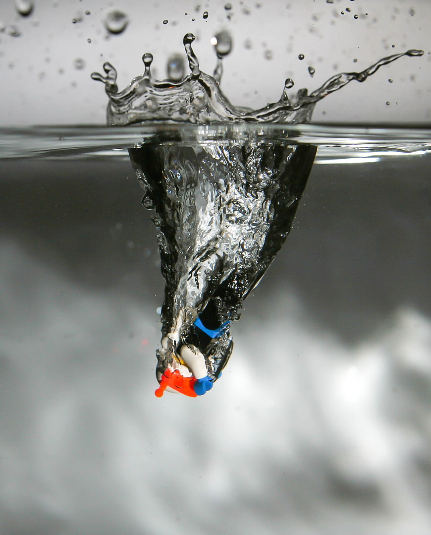 Lego Figure Diving Into Water With Splash And Bubbles