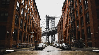 Manhattan Bridge View Between Red Brick Buildings