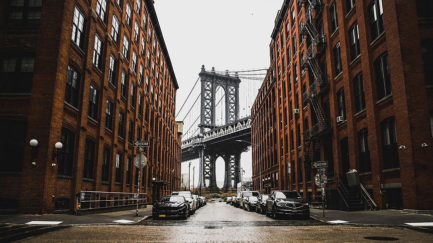 Manhattan Bridge View Between Red Brick Buildings