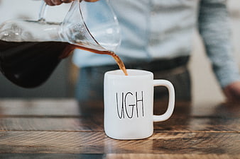 Pouring Coffee into White Mug with UGH Text