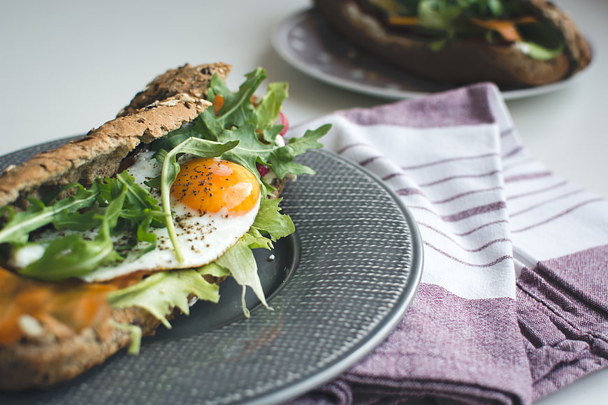Healthy Baguette Sandwich with Fried Egg and Arugula