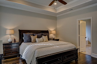 Elegant Master Bedroom with Dark Wood Furniture and Neutral Decor