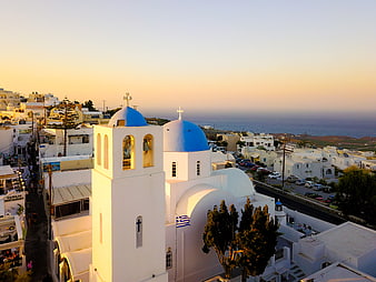 Santorini Church with Blue Domes at Sunset