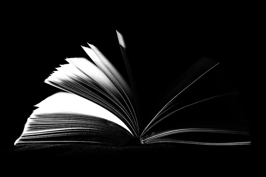 Dramatic Black and White Open Book with Flipping Pages