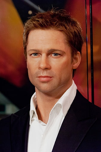 Portrait of a man in a suit with a white shirt