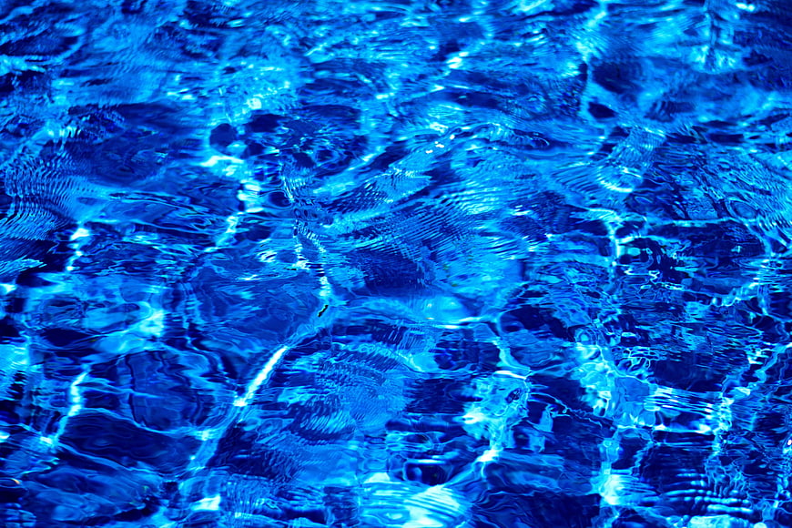 Vibrant Blue Swimming Pool Water Texture Background