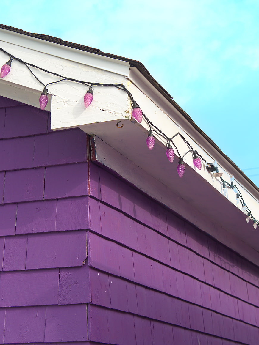 Purple House Exterior with Pink String Lights