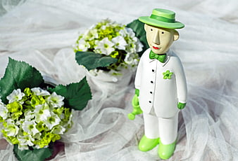 Green and White Groom Figurine with Flowers