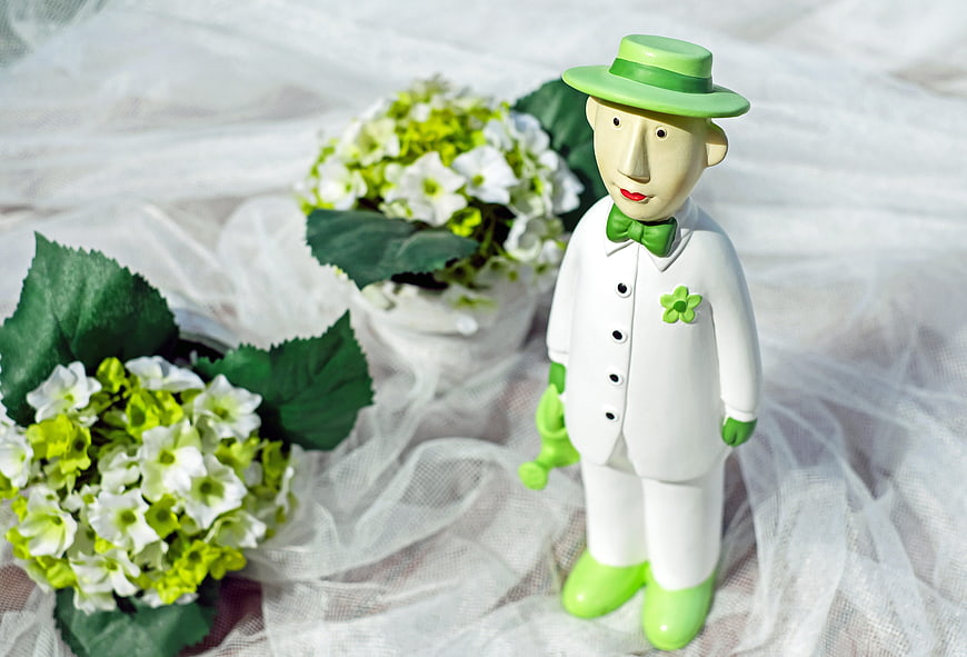 Green and White Groom Figurine with Flowers