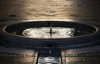 Nighttime Concrete Fountain with Rippling Water