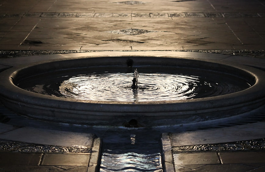 Nighttime Concrete Fountain with Rippling Water