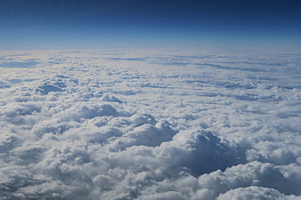 Aerial View of Endless White Clouds Under Blue Sky