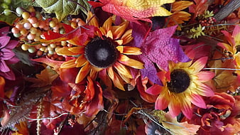 Close-up of colorful autumn floral arrangement with sunflowers and leaves