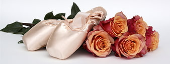 Ballet Shoes And Orange Roses On White Background
