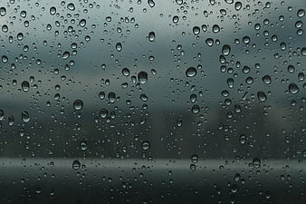 Raindrops on a Window Pane with Blurred Background