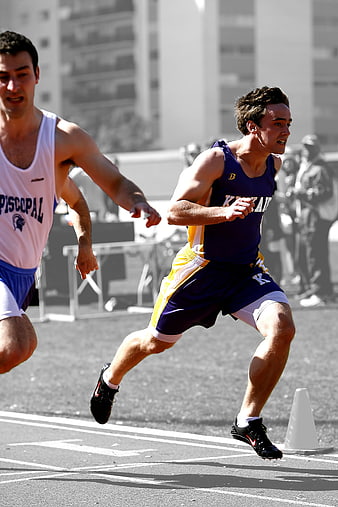 Male sprinters competing in a track and field race