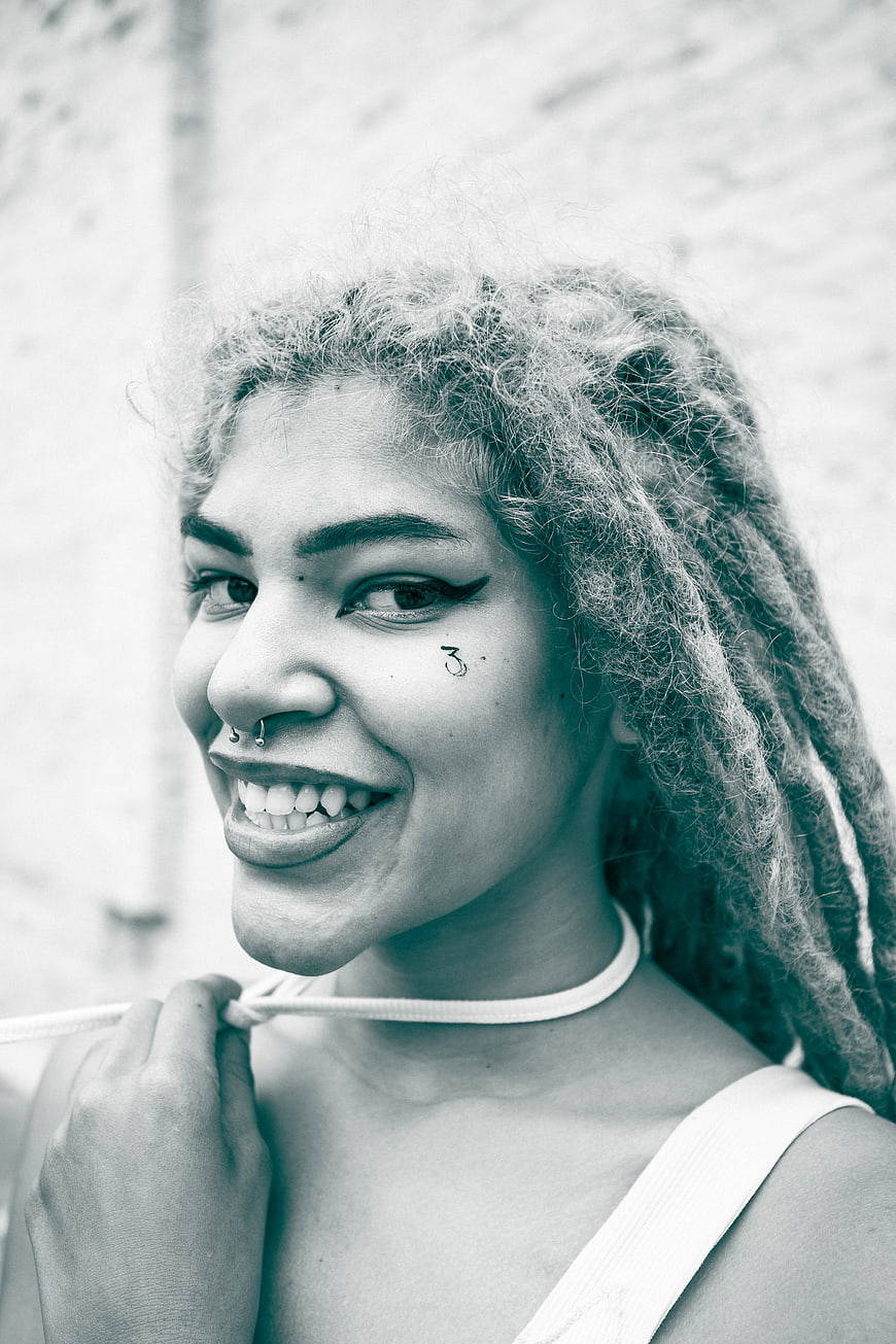 Stylish Woman with Dreads and Face Tattoo Portrait