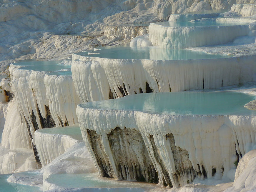 White travertine terraces with turquoise thermal pools at Pamukkale