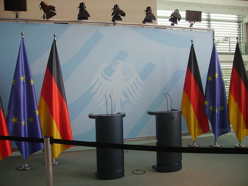 German and EU flags at press conference podiums